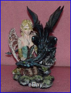 Large Blond Fairy With Angel Wings and Black Dragon Figurine