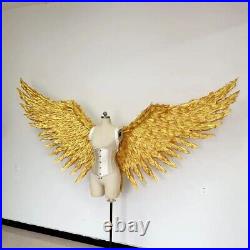 Large performance props display golden feather angel wings