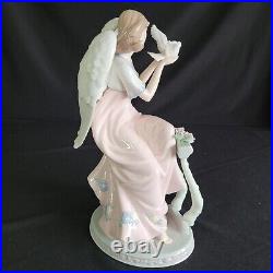 Mark O'Well Large Angel Opalescent Wings Leaning On Floral Trellis Holding Dove