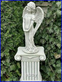 Stone large figurine angel with wings. Garden decoration. Grave decorative stone