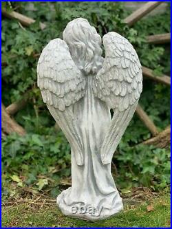 Stone large figurine angel with wings. Garden decoration. Grave decorative stone
