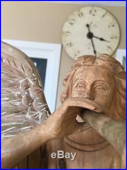 Very large, 29 tall, hand carved wood Angel, with wings and a horn on a pedestal
